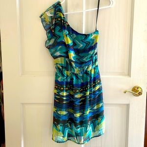 Off the shoulder dress with sheer overlay.